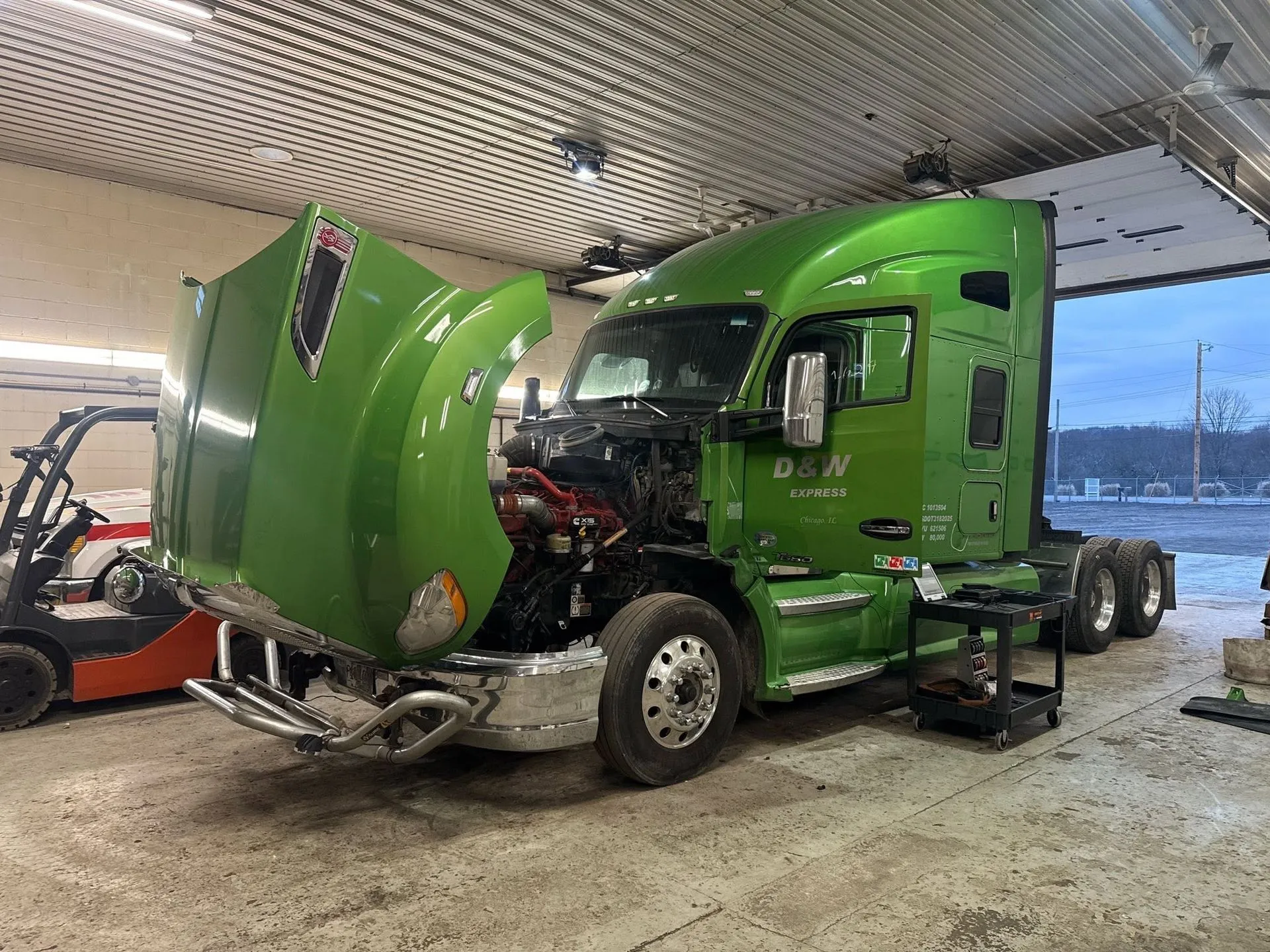 Kenworth semi truck in a working repair bay for semi truck repair near me